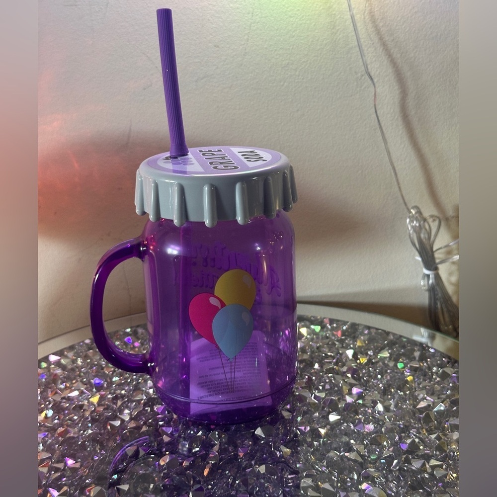 Disney Grape Soda cup with straw.